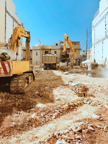 Construction yellow excavators trucks
